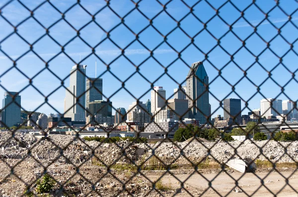 Stock image City behind a fence