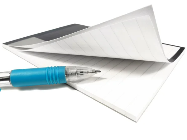 Böjda anteckningsblock och penna — Stockfoto