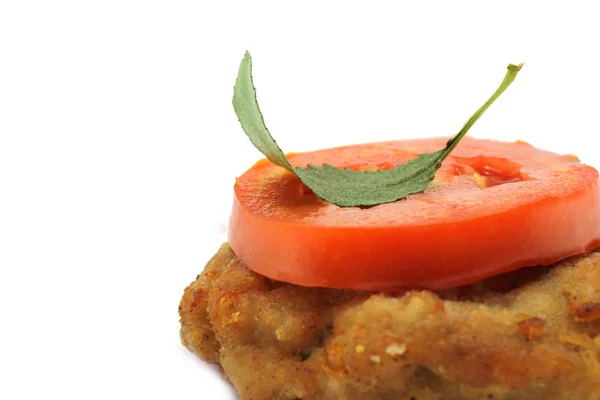 Cutlet and tomato in the right corner — Stock Photo, Image