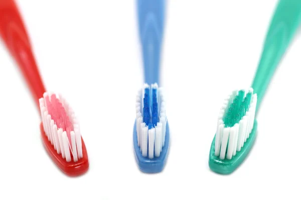 Три зубных щетки — стоковое фото
