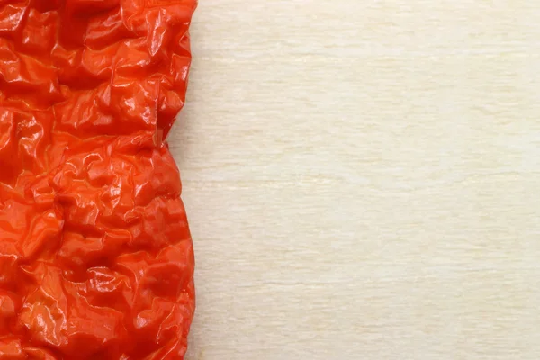 Czerwona papryka na drewnianej desce — Zdjęcie stockowe