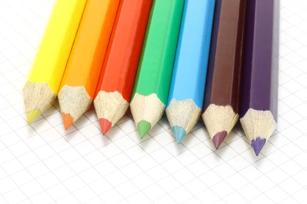 Big colour pencils on the notepad — Stok fotoğraf