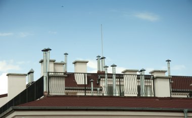 Many Chimneys on rooftop clipart