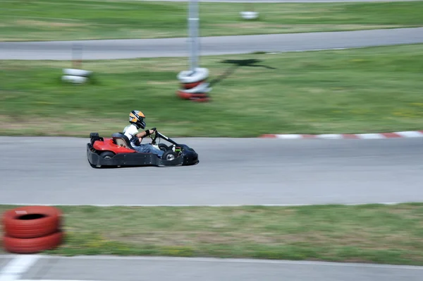 Boy drive car on kart track — Stock Photo, Image