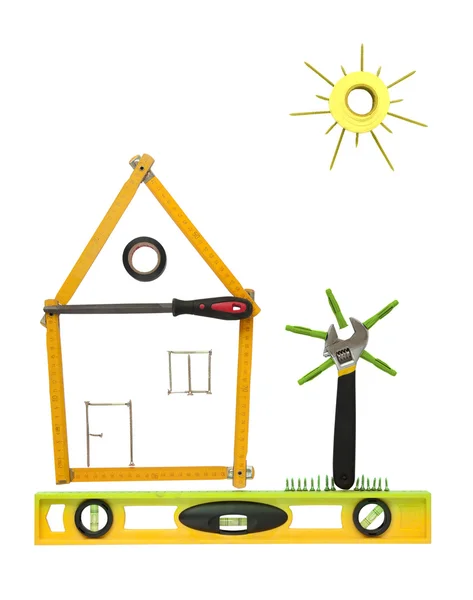 Будинок з деревом і сонцем з інструментів для будівництва . — стокове фото