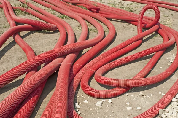 Red braided and turned tubes — Stock Photo, Image