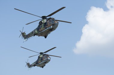 Green military helicopters. Horizontal image clipart