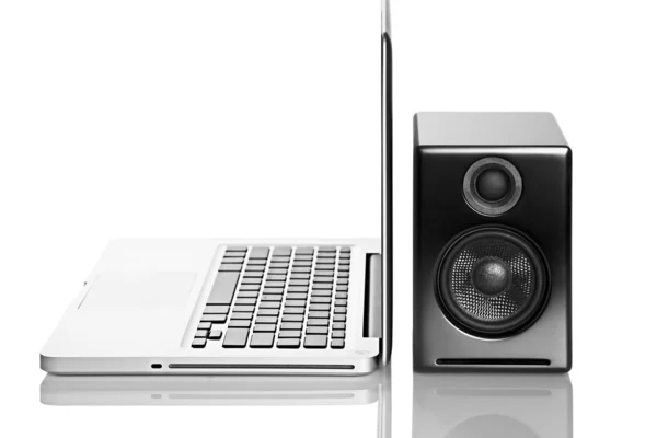 Stock image Laptop and speaker