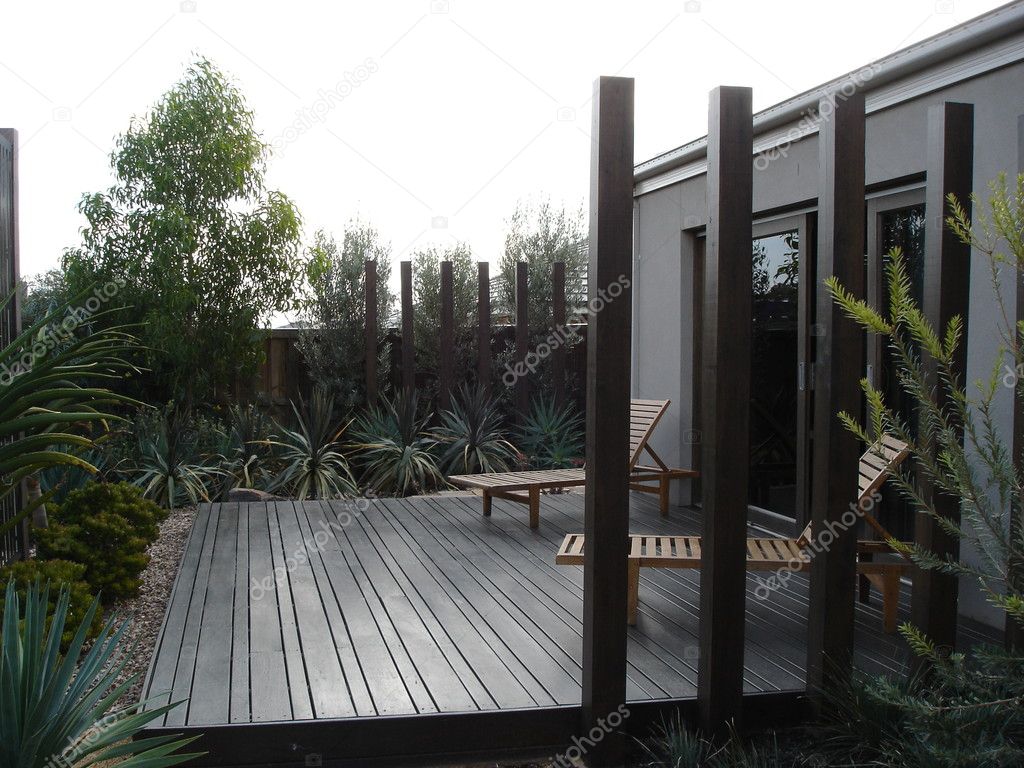 Modern home back yard with landscaped deck