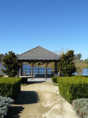 Gazebo portico at lake's edge clipart