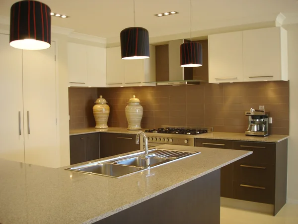 Modern kitchen warm tones open plan living — Stock Photo, Image