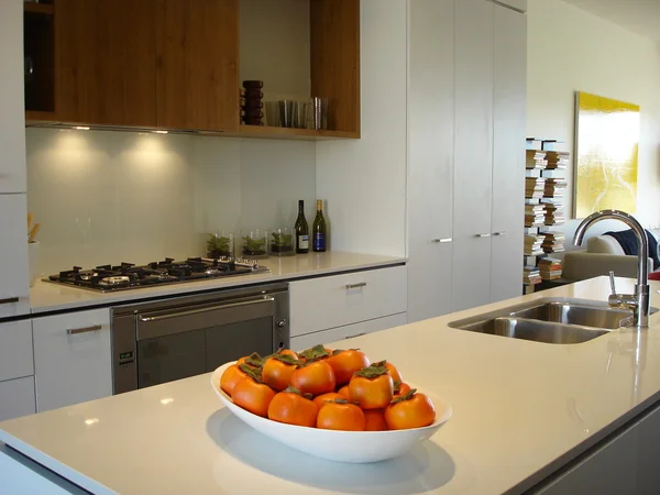 Modern kitchen warm tones open plan living — 图库照片