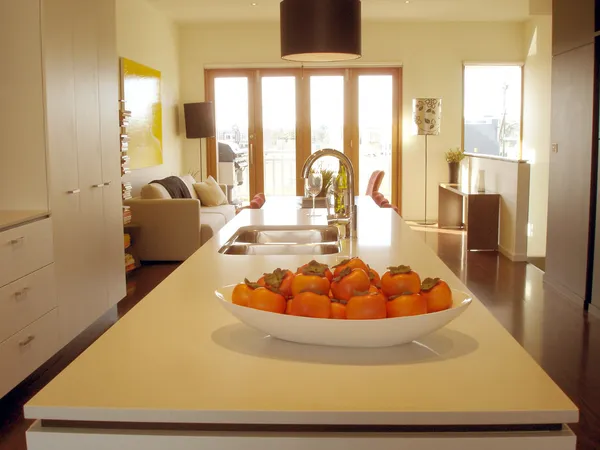 Modern kitchen warm tones open plan living — Stockfoto