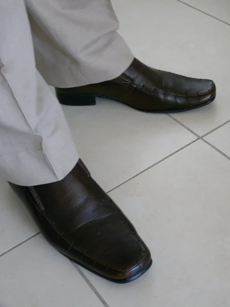 Well dressed man leather shoes
