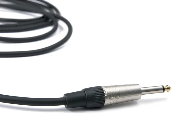 Zwarte muzikale kabel met een metalen stekker — Stockfoto