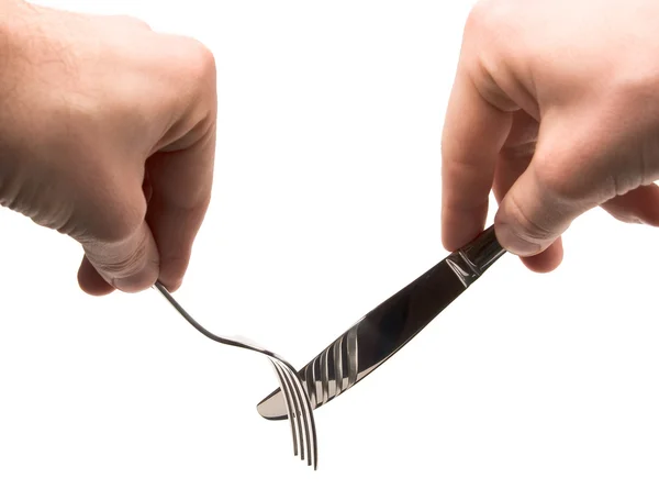 Hands holding empty fork and knife — Stock Photo, Image