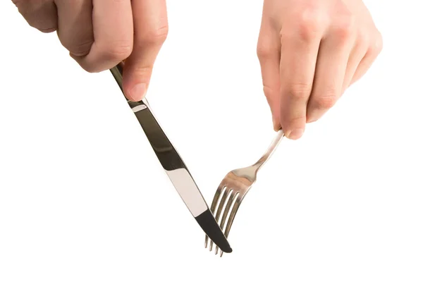 Hands holding empty fork and knife — Stock Photo, Image