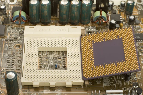 Microprocessor and socket in motherboard — Stock Photo, Image