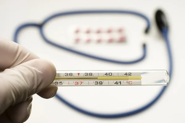 stock image Thermometer symbolizing fever