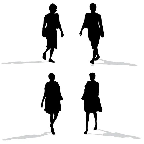 Mulheres caminhando, silhuetas vetoriais — Vetor de Stock