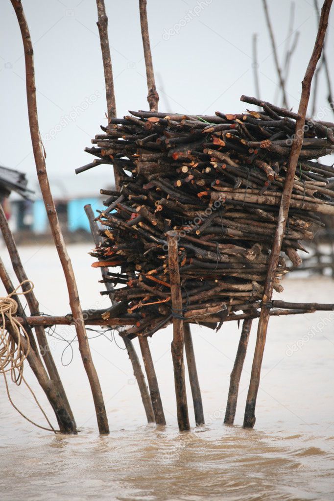 Storage for firewood in Cambodian floating village
