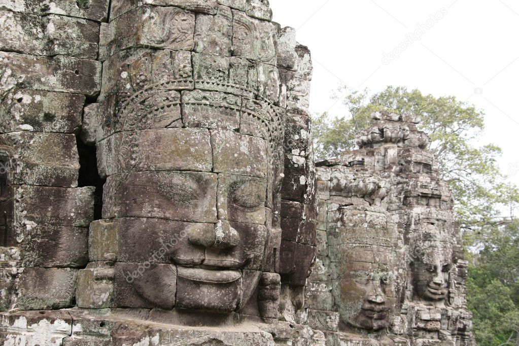 Budha Head. Fragment of stone carving in the ancient temple