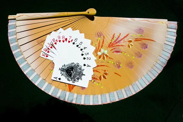 Hearts to Spades on a fan with black background — Stock Photo, Image