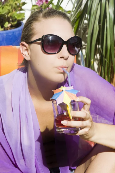 Beautiful girl with a long drink Royalty Free Stock Images
