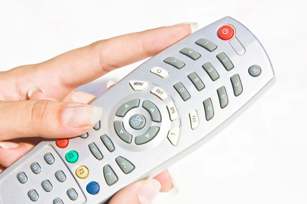 TV remote at woman hand Royalty Free Stock Images