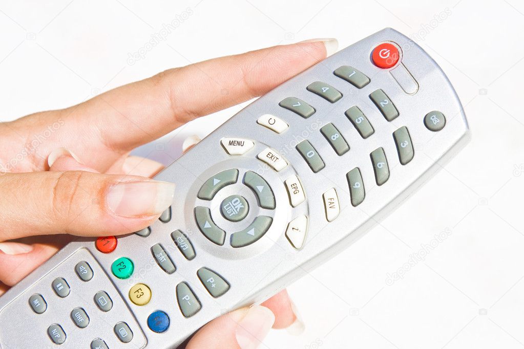TV remote at woman hand