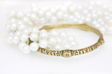 Brass bracelet and imitation pearls clipart