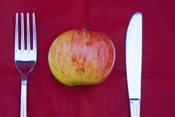 Apple with fork and knife — Stock Photo, Image