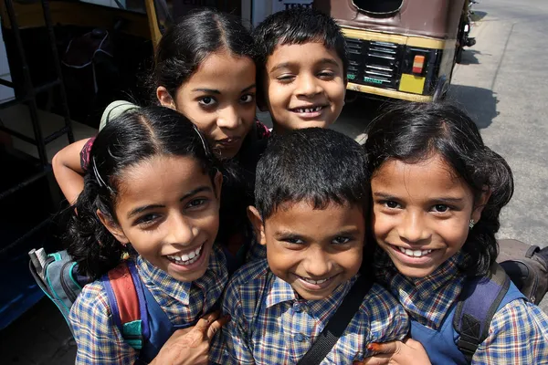 stock image Happy Indian schoolchild come back from school