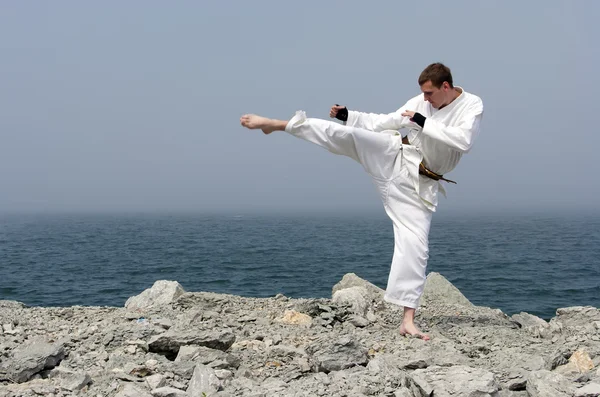 Karate on the shores of the misty sea — Stock Photo, Image