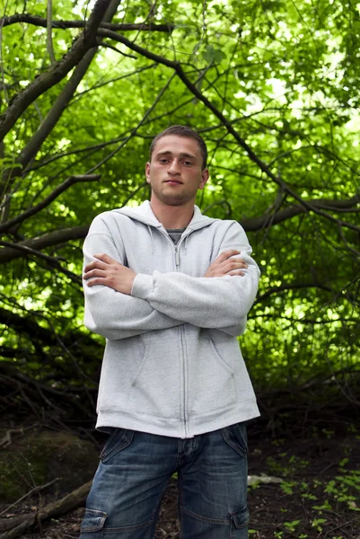 Portrait of a man in a forest — Stock Photo, Image