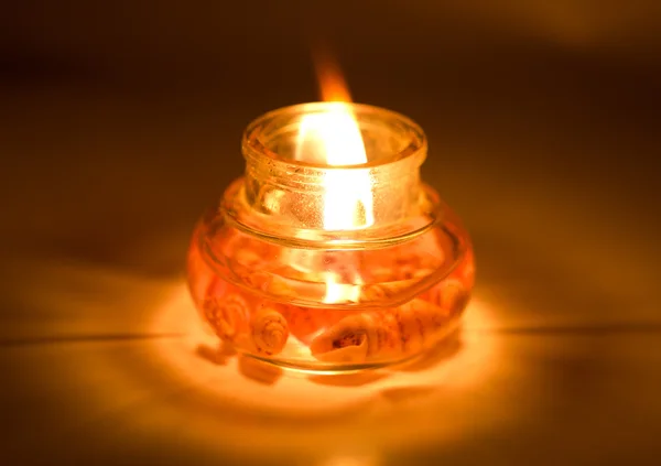 Candle is lit in the dark — Stock Photo, Image