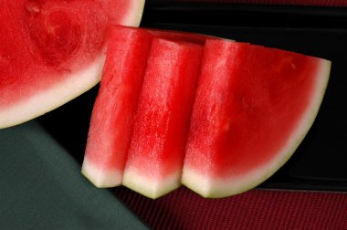 Seedless watermelon cut in wedges clipart