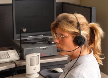 Police dispatcher sitting at a dispatch console clipart