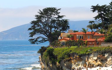 Luxury home along the California coast clipart