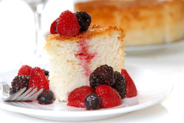 Slice of Angel Food Cake with fresh fruit clipart