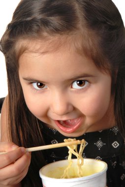 Young girl eating noodle soup clipart