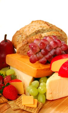 Assorted fruits and cheeses clipart