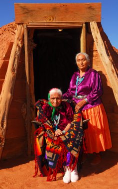 Elderly Navajo woman with her daughter clipart