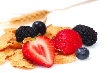 Bran cereal with blueberries, strawberries and blackberries clipart