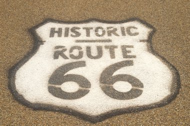 Route 66 sign on pavement clipart