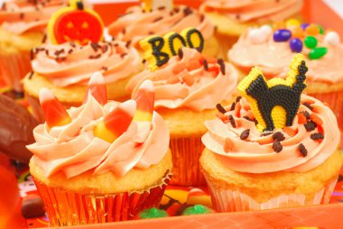 Halloween cupcakes on a serving tray clipart