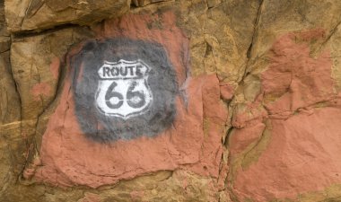 Route 66 sign painted on rocks in New Mexico clipart