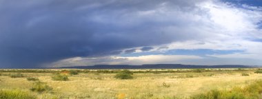 Storm clouds forming in New Mexico along Route 66 clipart