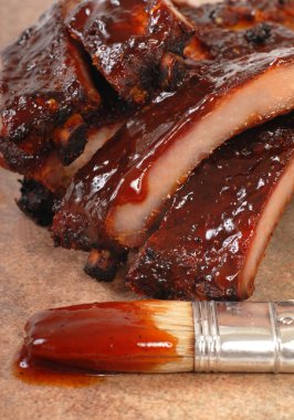 Delicious BBQ ribs with tangy sauce clipart