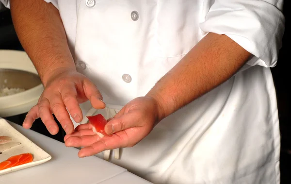 stock image Sushi chef making fresh salmon and tuna sushi nigiri